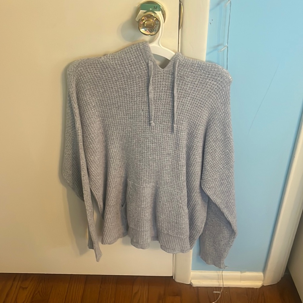 grey textured sweater with a hood